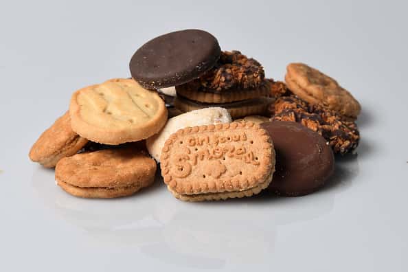 A small pile of a variety of Girl Scout Cookies.