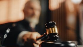 Court of Law and Justice Trial Session: Imparcial Honorable Judge Pronouncing Sentence, striking Gavel. Focus on Mallet, Hammer.