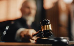 Court of Law and Justice Trial Session: Imparcial Honorable Judge Pronouncing Sentence, striking Gavel. Focus on Mallet, Hammer.