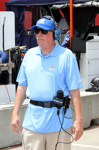 A photo of Robin Miller covering an Indycar race for NBC Sports