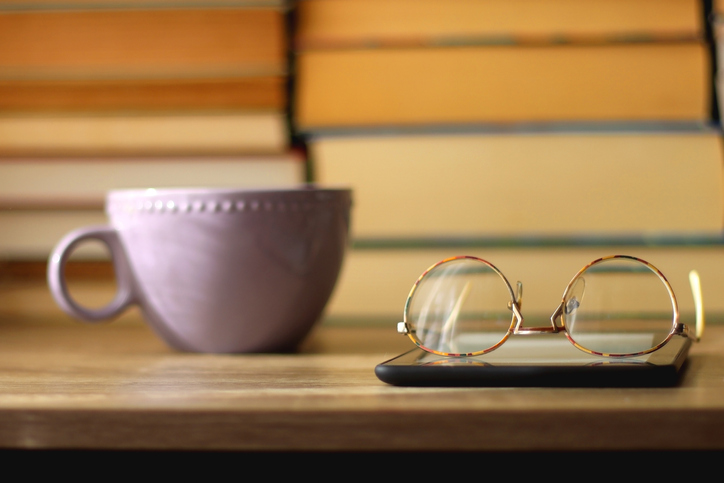 Cup, Books, E-Reader and Glasses