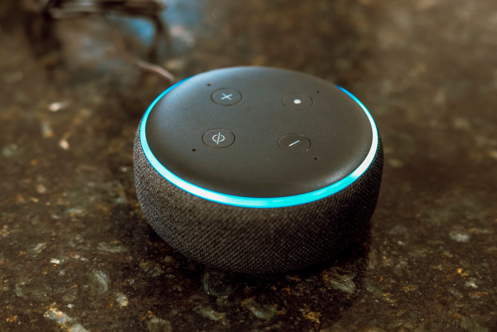 In this photo illustration, Echo Dot smart speaker with...