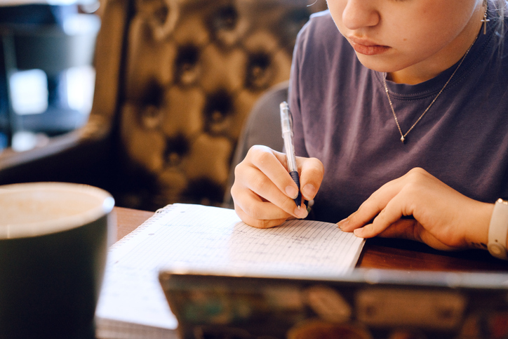 Teenage girl sitting in the cafe