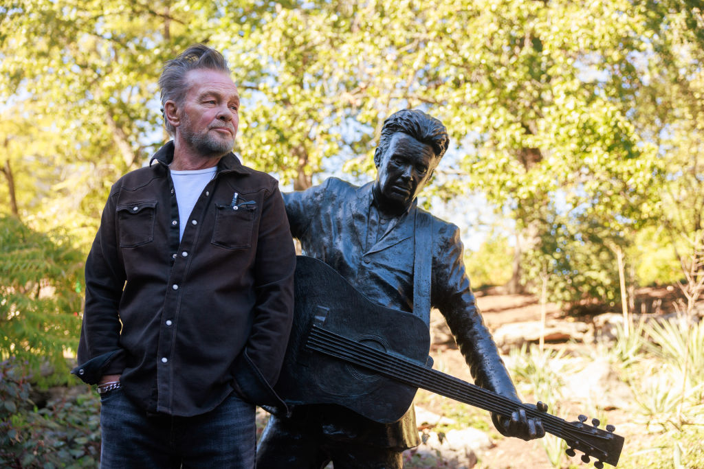 Rock star and singer-songwriter John Mellencamp stands next...
