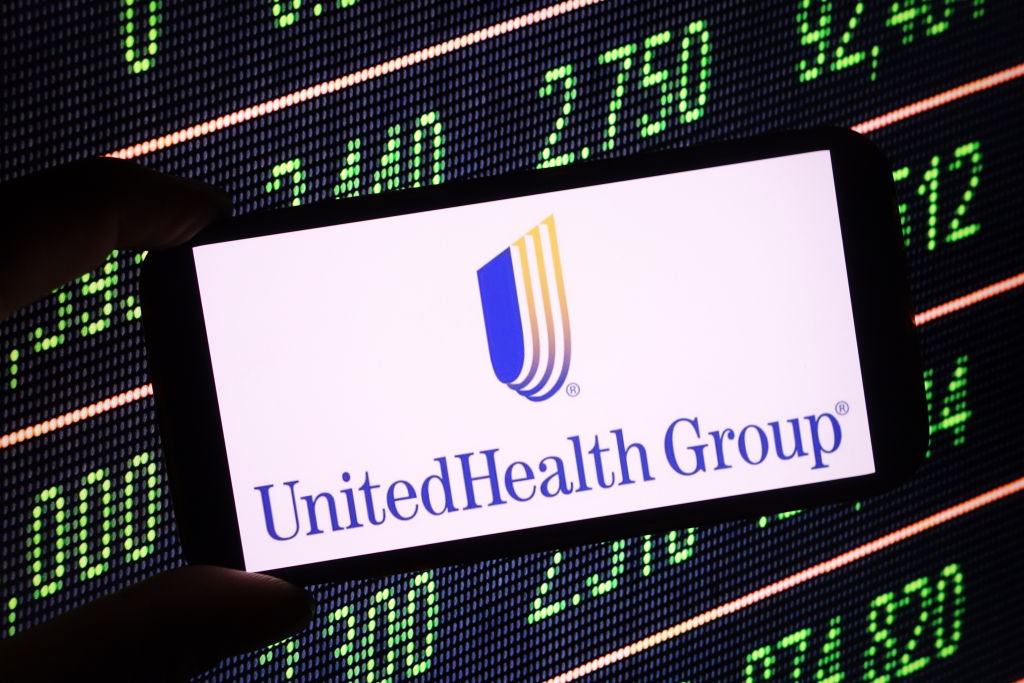 In this photo illustration, the UnitedHealth company logo is...