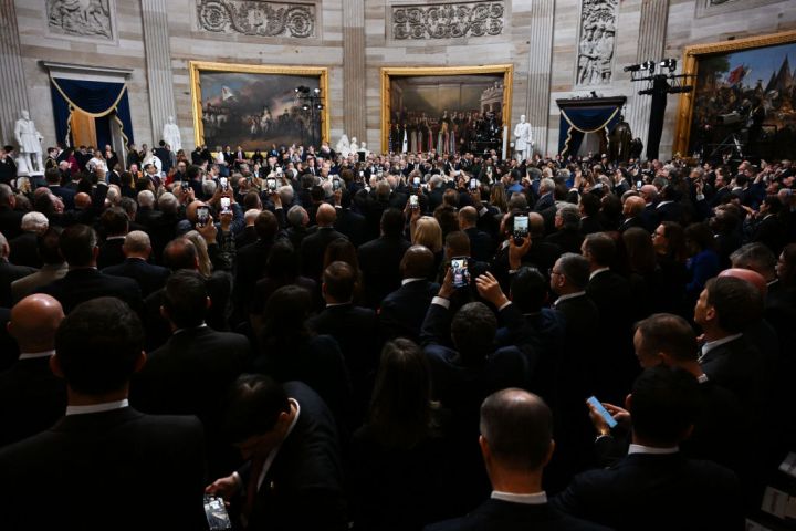 Attendees sit in the Rotunda during the 60th inaugural ceremony.