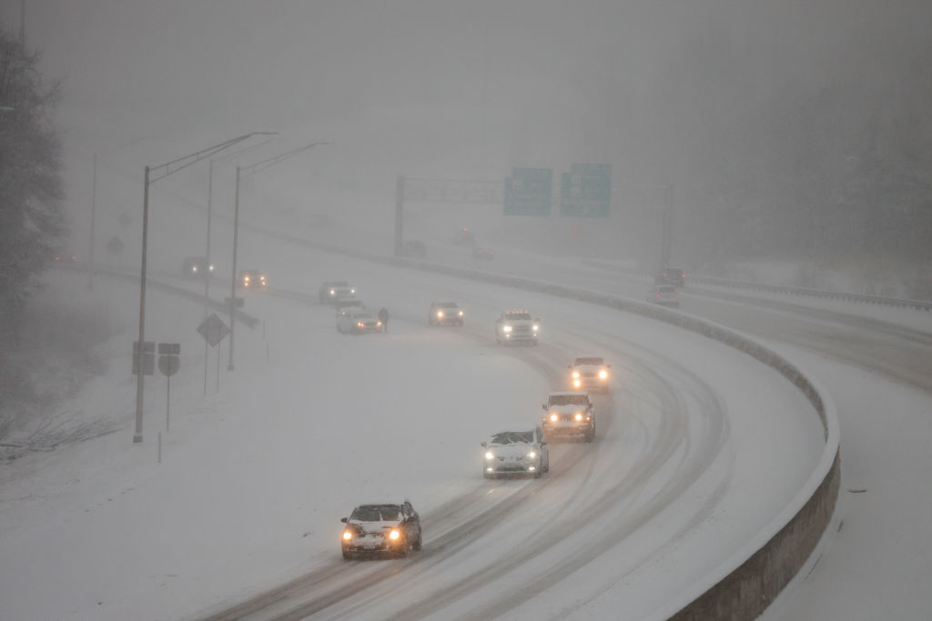 Traffic along the snow-covered I-69 during the snowfall in...