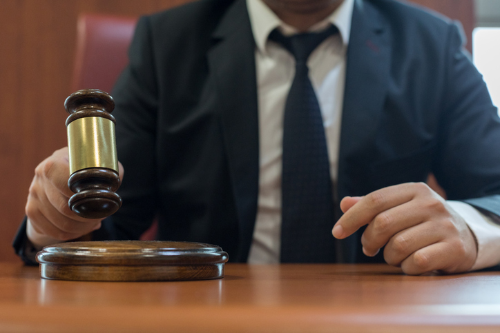 Holding judge gavel