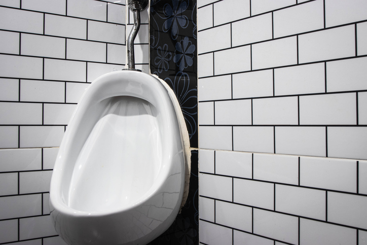 White urinal men public toilet.