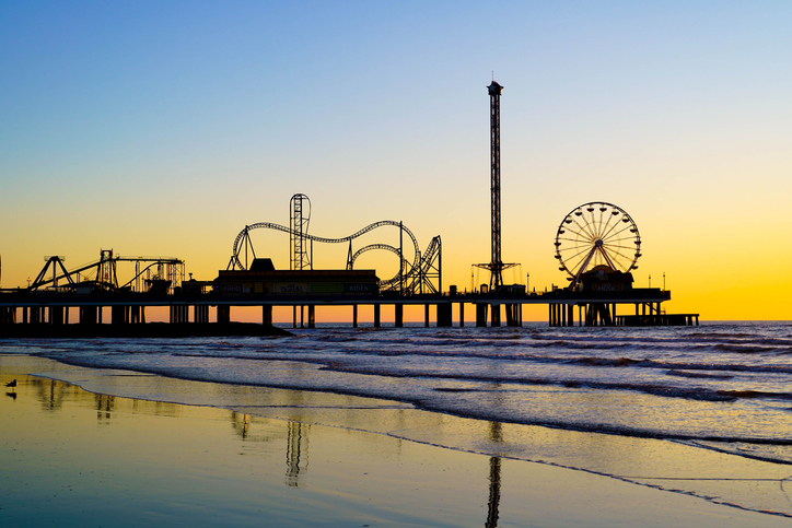 Pleasure Pier in Silhouette at Sunrise on the Gulf of Mexico, Galveston, Texas, United States