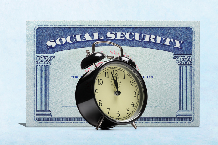 Alarm Clock In Front Of Social Security Card