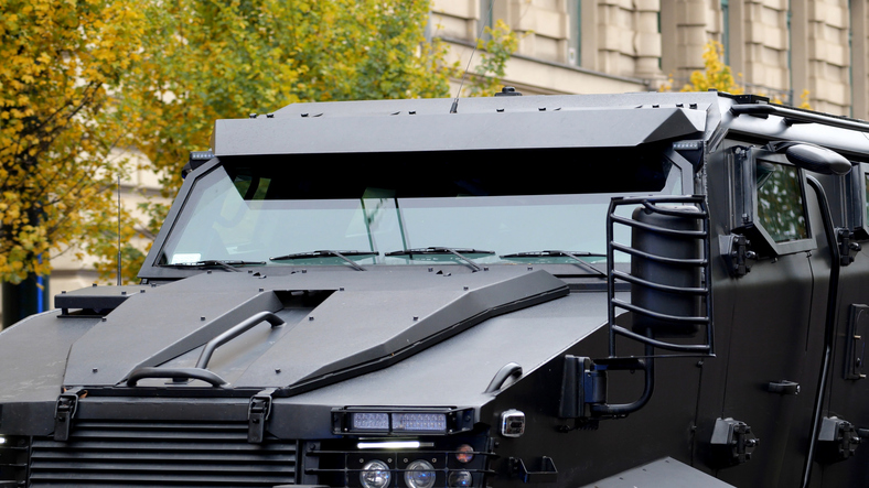 Simple modern design heavy armored police army vehicle closeup detail shot, professional special forces anti-terrorist team vehicles and equipment abstract concept, nobody, no people, jail transport